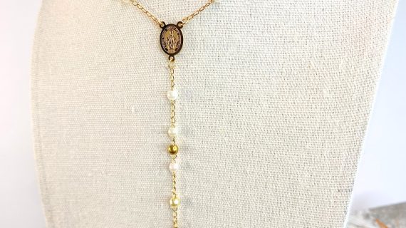 rosary of saint benedict and pearls